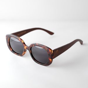 Bucharest night bamboo sunglasses open on a white background. They have grey lenses, tortoise frame and brown arms